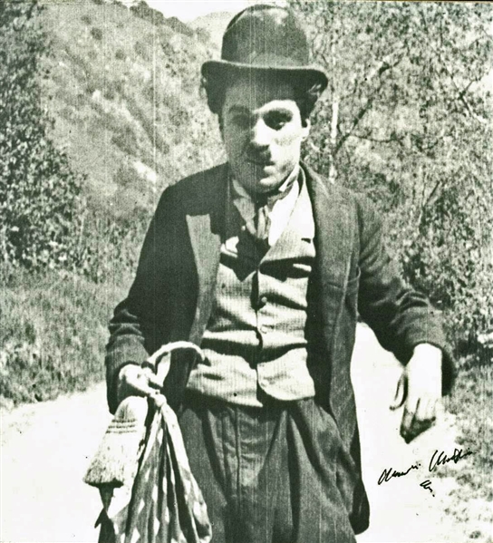 Exceptional Charlie Chaplin Signed 6.75" x 7.5" Paperstock Photo of Chaplin as "The Tramp"! (PSA/DNA)