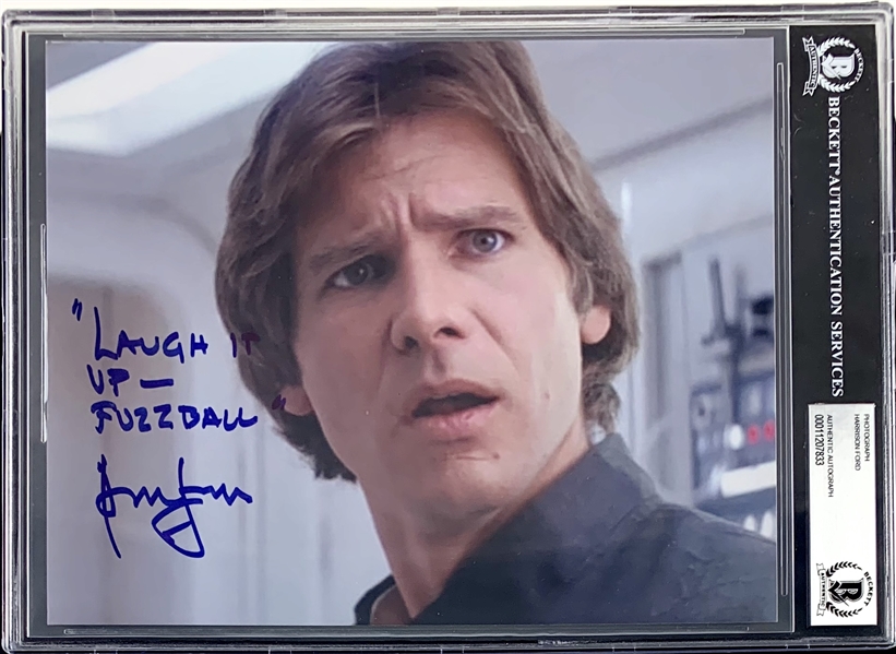 Harrison Ford Signed 8" x 10" Empire Strikes Back Color Photo with Amazing "Laugh It Up Fuzzball" Inscription (Beckett/BAS Encapsuated)(Steve Grad Collection)