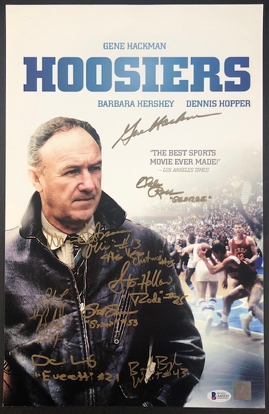 "Hoosiers" Mini-Poster with 9 signatures, including Gene Hackman, Chelcie Ross, Brad Boyle, David Neidorf, Steve Hollar, Maris Valainis, Brad Long, Scott Summers, and Wade Schenck !