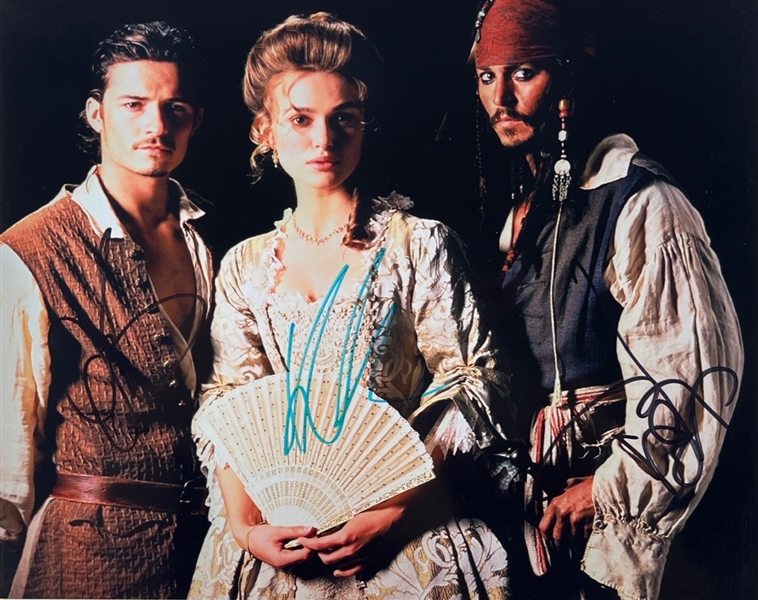 Pirates of the Caribbean : Cast Signed 8" x 10" Photo w/ Depp, Bloom, and Knightley! (3 Sigs)(Beckett/BAS LOA)
