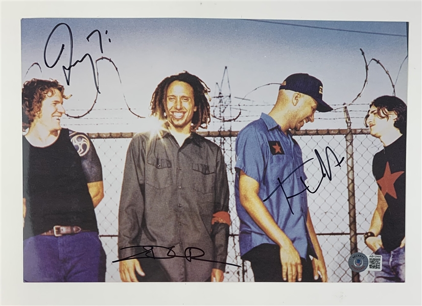 Rage Against The Machine Group Signed 8" x 12" Photo (3 Sigs)(Beckett/BAS LOA)(Steve Grad Autograph Collection)