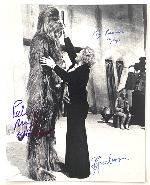Star Wars: Peter Mayhew Chewbacca  8” x 10” Photo Also Signed By Makeup Artists Stuart & Kay Freeborn from Mos Eisley Cantina “A New Hope” (Beckett/BAS Guaranteed)