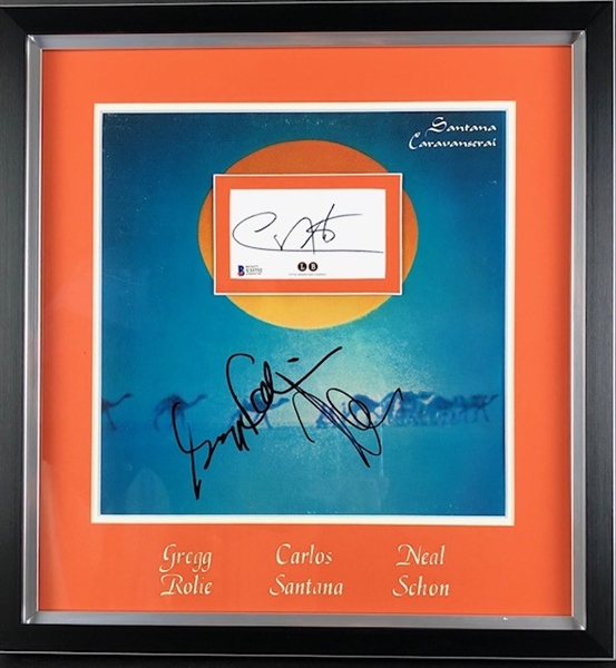 Framed "Caravanserai" Album Cover signed by Neal Schon and Gregg Rolie and matted with a 3" x 5" Cut signed by Carlos Santana (Beckett/BAS and JSA)