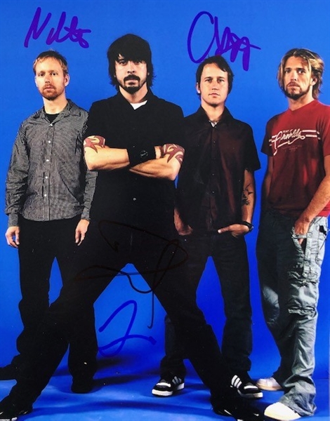 Foo Fighters: Nate Mendel, Dave Grohl, Chris Shiflett, Taylor Hawkins signed 8" x 10" Photograph.(Beckett/BAS Guaranteed)