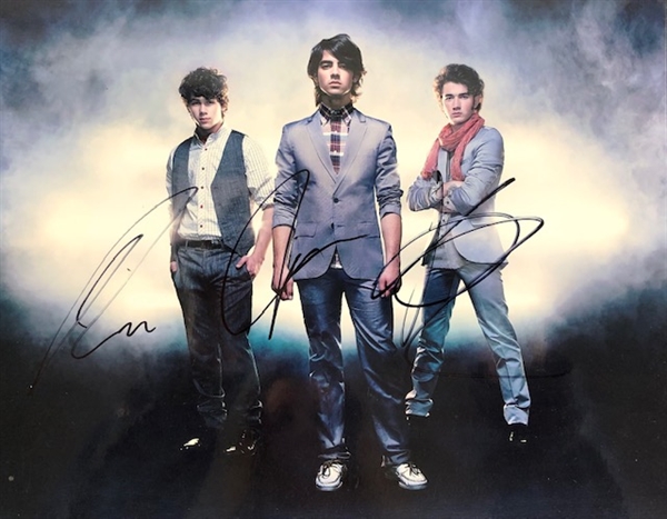 Jonas Brothers: Nick, Joe, and Kevin Jonas Signed 10" x 8" Photograph (Beckett/BAS Guaranteed) 