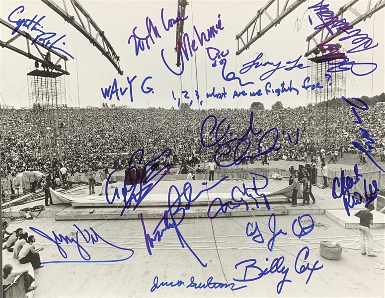 Woodstock Multi-Signed 11" x 14" B&W Photo with Country Joe, Wavy Gravy, etc. (15 Sigs)(PSA/DNA Auction Style LOA)(Beckett/BAS Guaranteed)