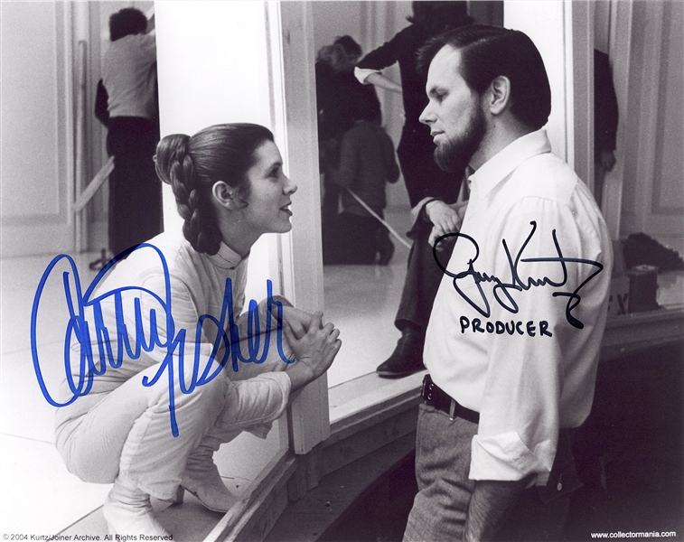 Star Wars: Carrie Fisher & Gary Kurtz Behind-the-Scenes Signed 10” x 8” Photo from “The Empire Strikes Back” (Beckett/BAS Guaranteed)