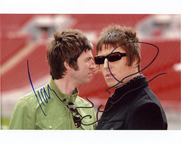 Oasis: Liam & Noel Gallagher Dual Signed 10” x 8” Photo (Beckett/BAS Guaranteed)