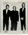Genesis 1990s Group Autographed Virgin Records Promotional Photograph (3 Sigs) (Third Party Guaranteed)
