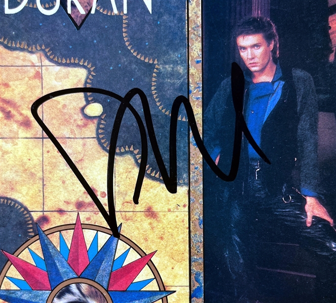 Duran Duran: Group Signed Seven and the Ragged Tiger Album Cover (4 Sigs)(Beckett/BAS)
