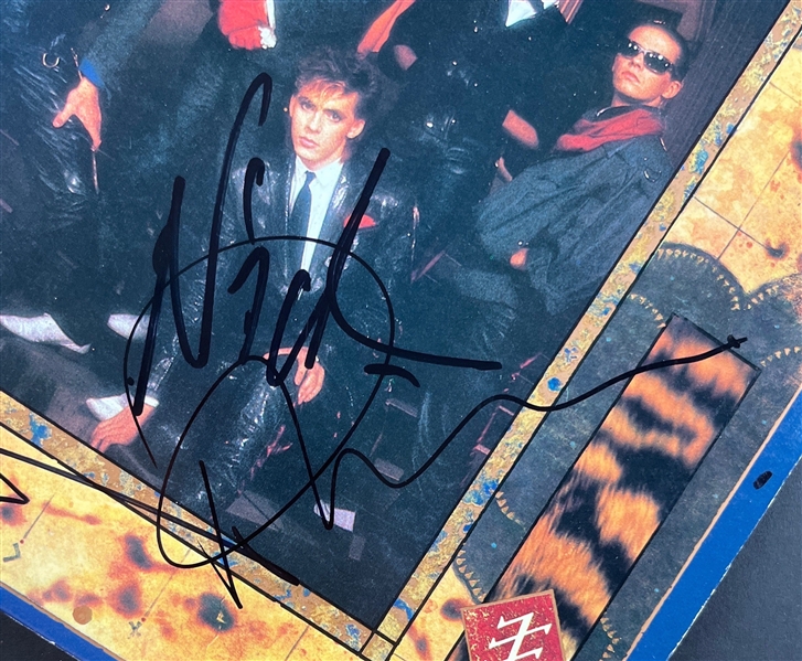 Duran Duran: Group Signed Seven and the Ragged Tiger Album Cover (4 Sigs)(Beckett/BAS)