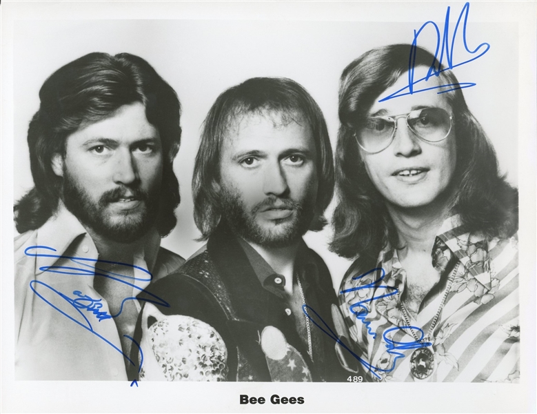 Bee Gees: Barry, Robin, and Maurice Gibb Signed 8" x 10" Photo (Epperson/REAL)